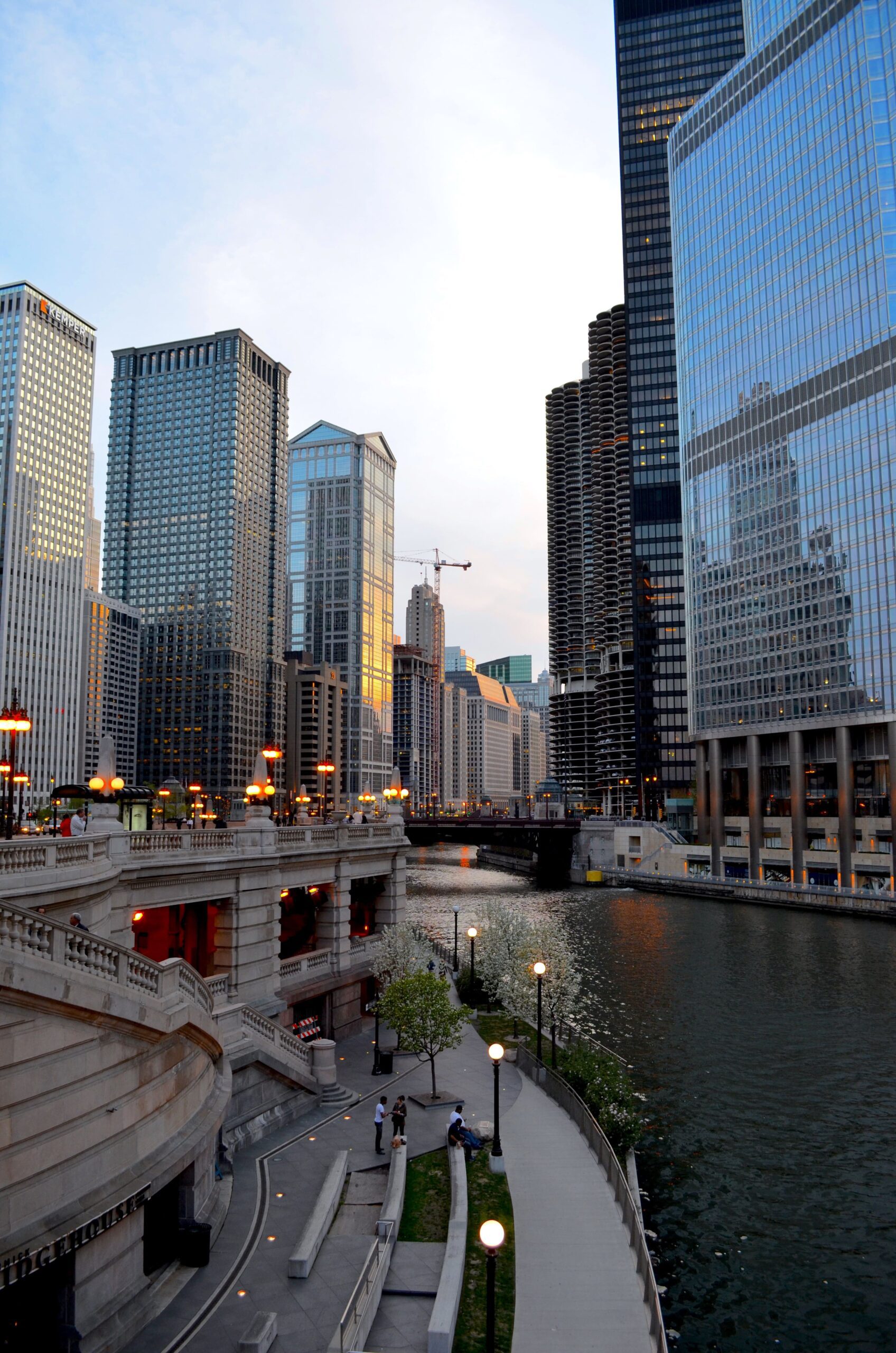 Image of Chicago River flanked by tall buildings on either side in Chicago, Illinois.