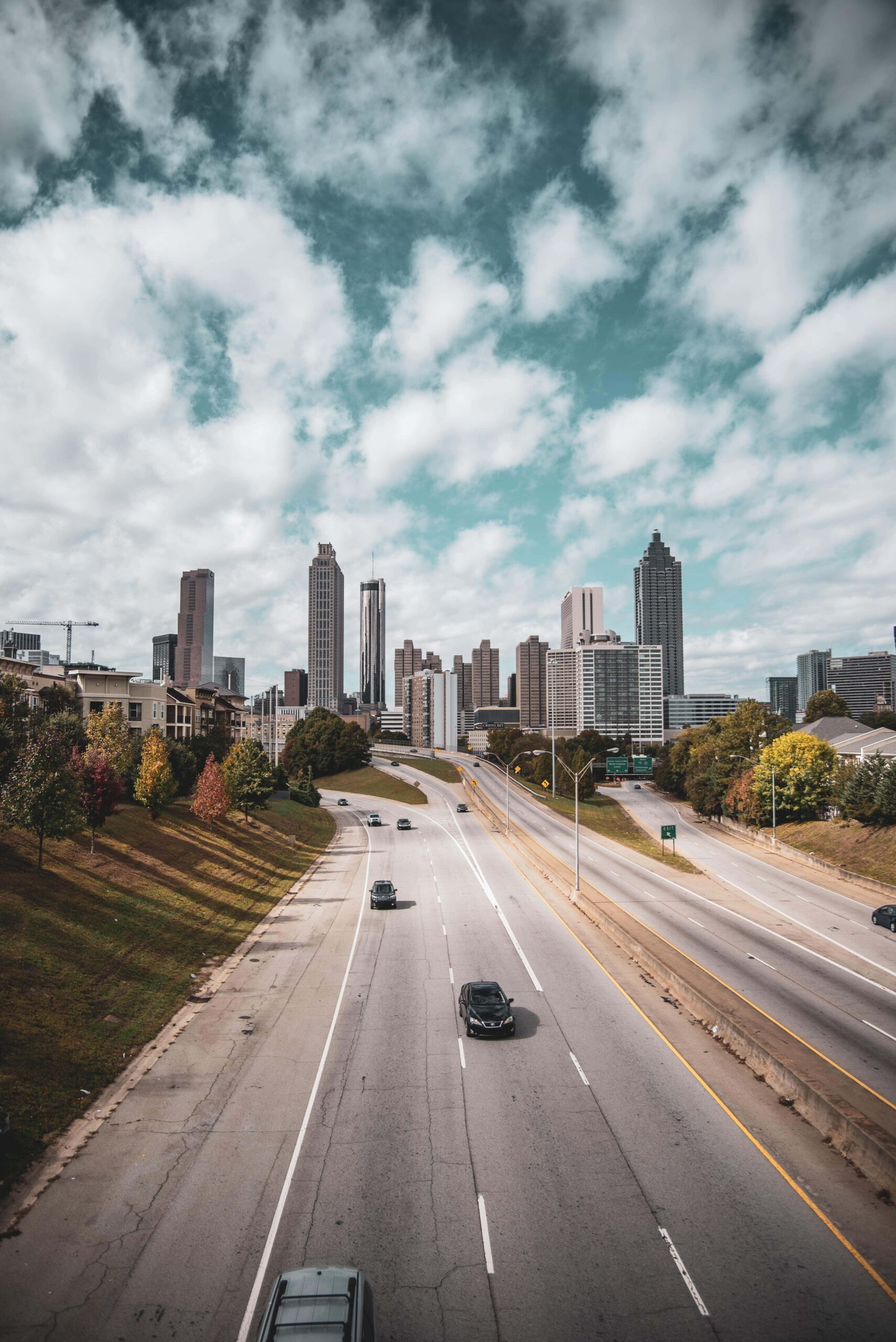 Atlanta, Georgia skyline with highway and clouds.