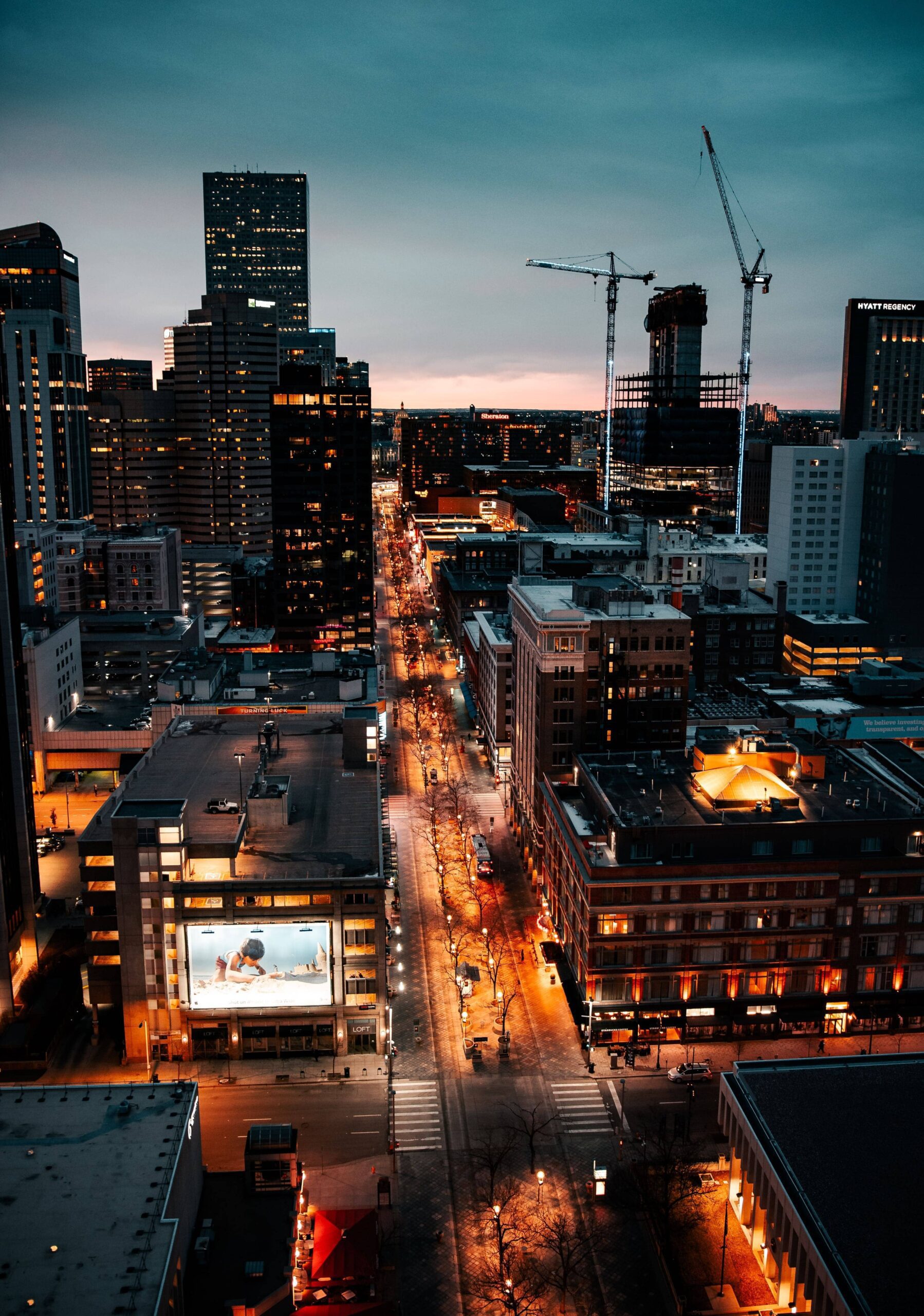 Denver, Colorado skyline and city lights at dusk.