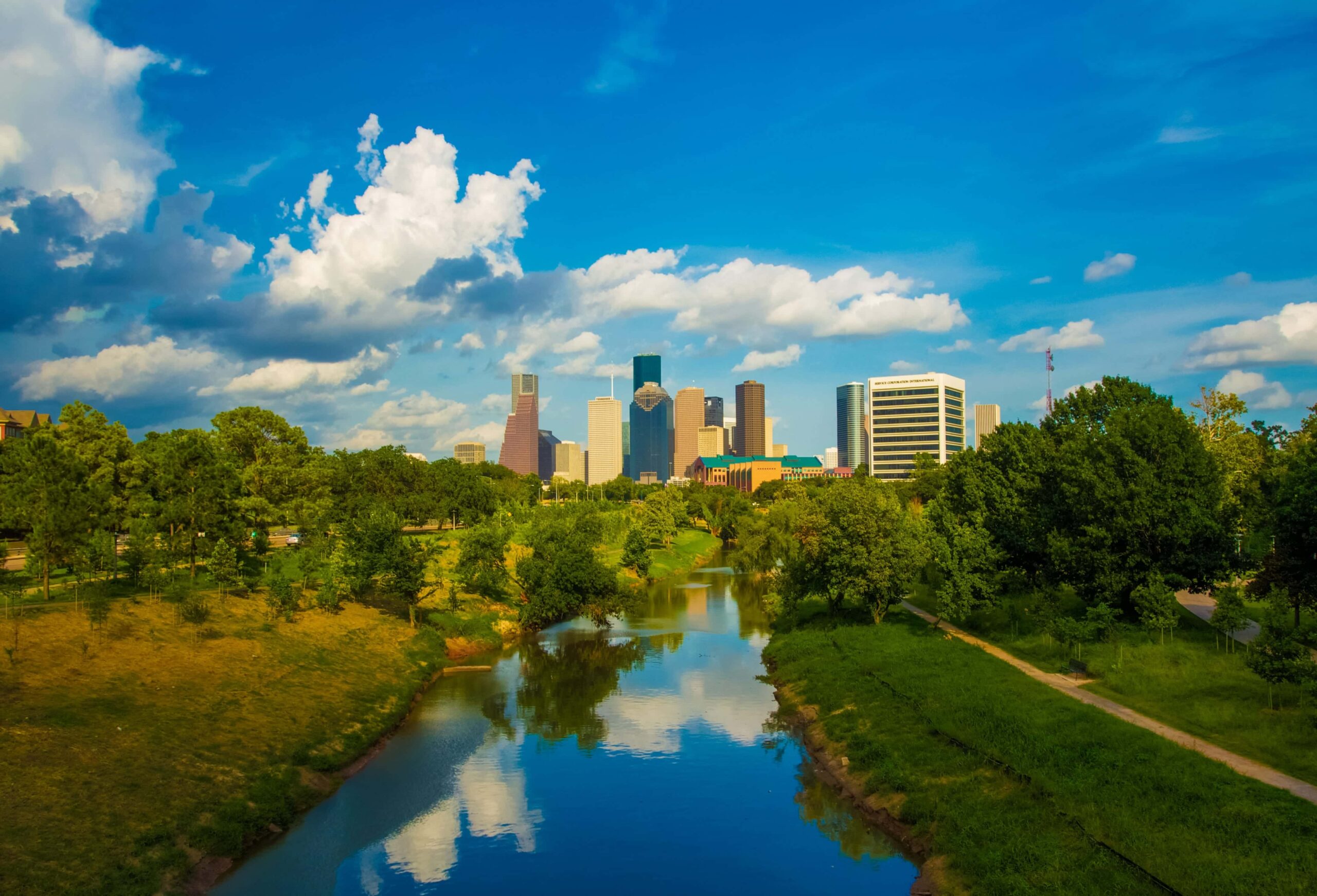 Houston, Texas skyline with trees and waterway