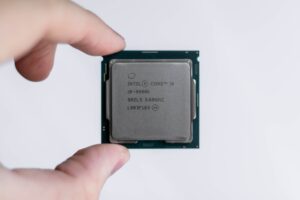 a person holding an Intel processor.
