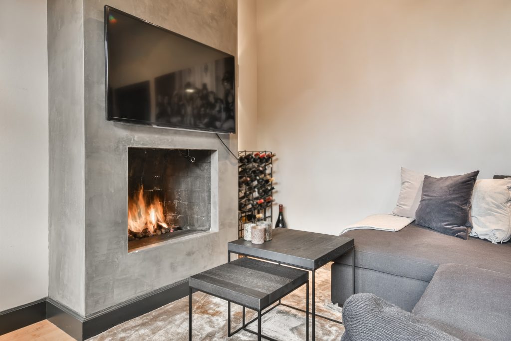 mounted tv above fireplace in a living room