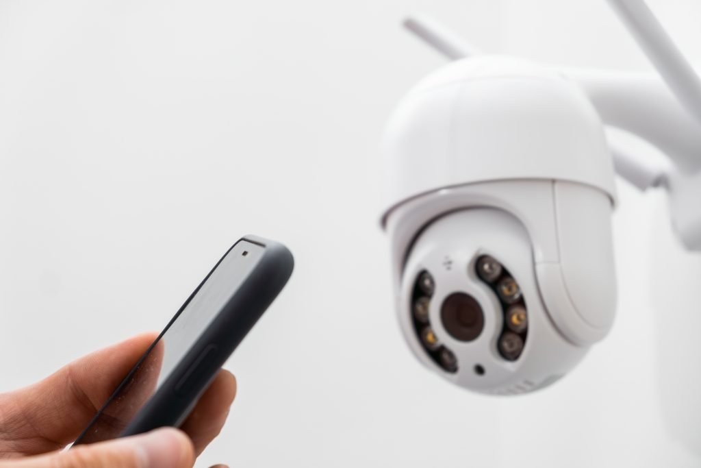 person setting up cctv camera