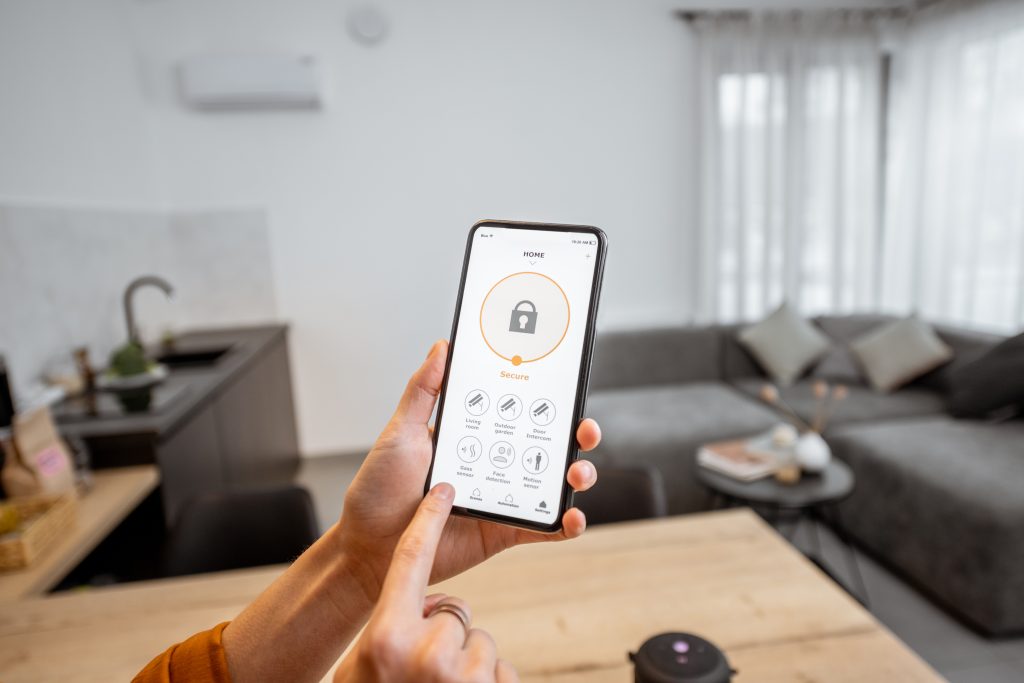 woman using smart home cybersecurity solutions on tablet