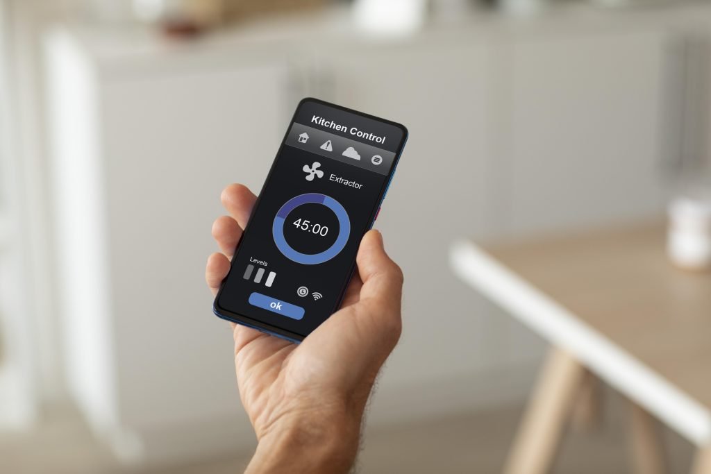 man-holding-smartphone-with-home-automation