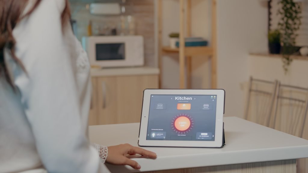 young-woman-using-smart-home-application-with-voice-command-turn-light-by-tablet