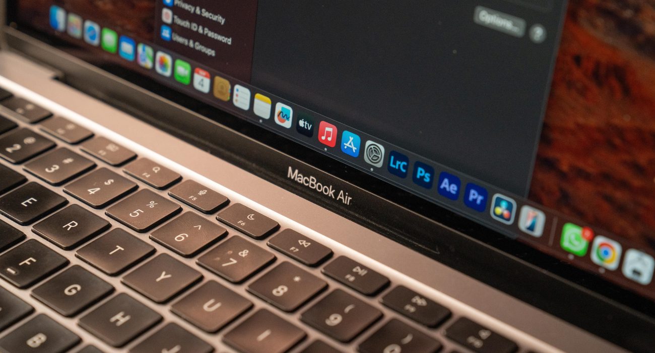 MacBook Air with macOS System Settings open before checking CPU temperature