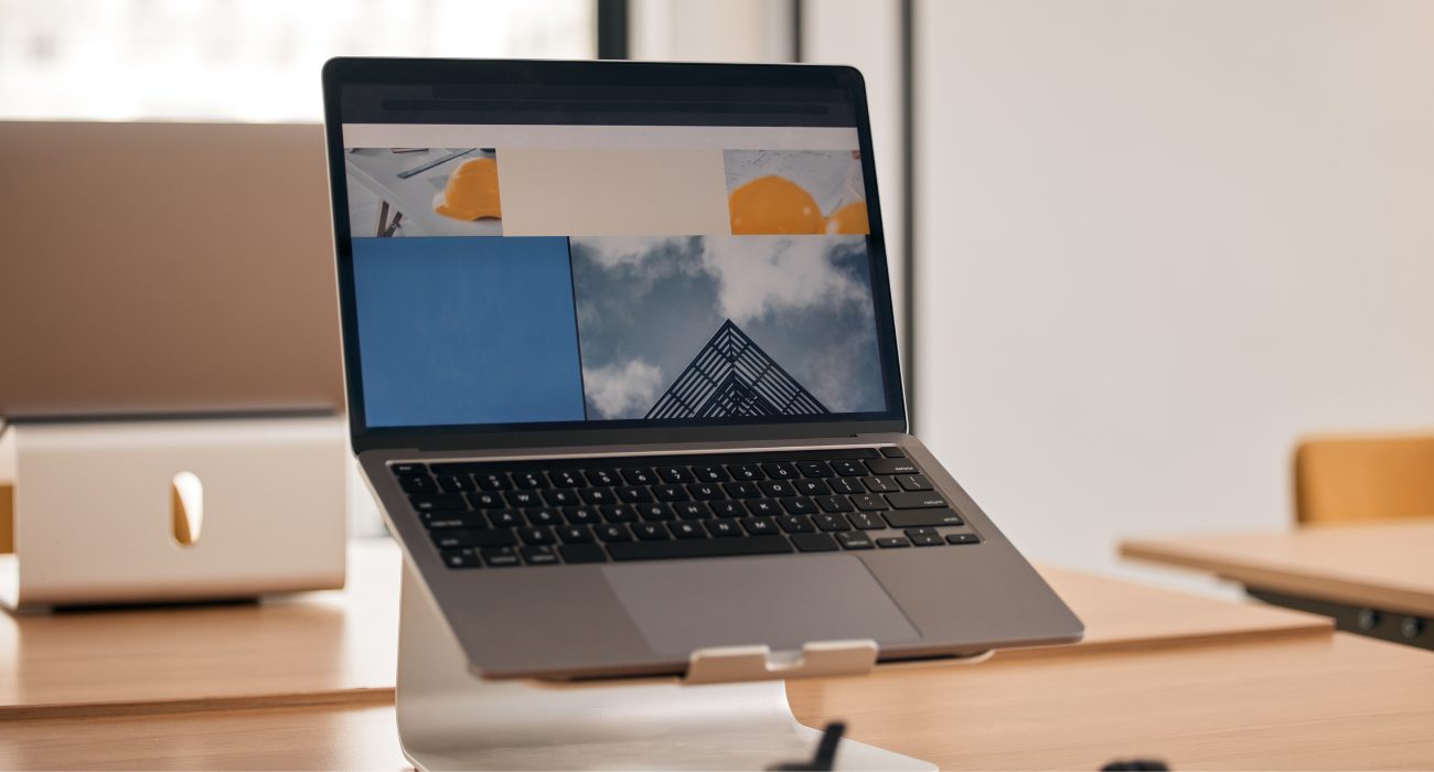 MacBook on a laptop stand to improve airflow and maintain safe CPU temperatures