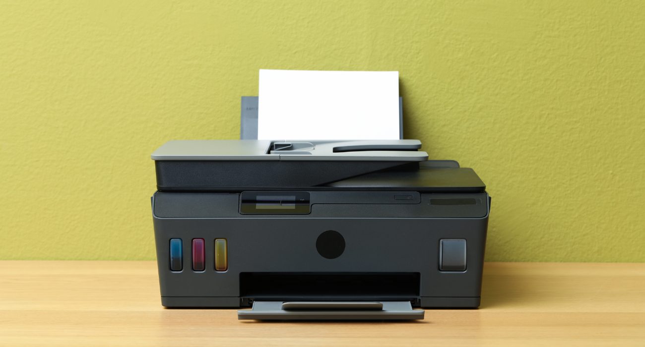 HP printer with display showing network settings for the MAC address